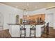 Kitchen with dark granite countertops, bar stool seating, stainless appliances, and wooden cabinetry at 10664 Emerald Chase Dr, Orlando, FL 32836