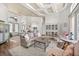 Bright living room with hardwood floors, coffered ceiling, and elegant furnishings at 10664 Emerald Chase Dr, Orlando, FL 32836