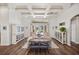 Bright living room with hardwood floors, coffered ceiling, and elegant furnishings at 10664 Emerald Chase Dr, Orlando, FL 32836