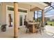 Well-equipped outdoor kitchen with bar seating, ideal for hosting gatherings and enjoying outdoor dining at 10664 Emerald Chase Dr, Orlando, FL 32836