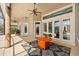 Inviting covered patio with stylish outdoor furniture, providing a comfortable space for relaxation at 10664 Emerald Chase Dr, Orlando, FL 32836