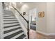 Staircase leading to the first floor, with a bedroom in the background at 10664 Emerald Chase Dr, Orlando, FL 32836