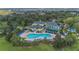 Amazing aerial view of the resort with a pool, hot tub, tennis courts, and well-manicured landscaping at 107 Rum Run # 107, Davenport, FL 33897