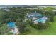 Stunning aerial view of a community center with a pool, splashpad, and lush landscaping at 107 Rum Run # 107, Davenport, FL 33897