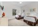 Inviting bedroom with twin beds, enhanced by natural light and tasteful decorations at 107 Rum Run # 107, Davenport, FL 33897