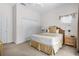 Serene bedroom featuring a cozy bed, ample closet space, and natural light at 107 Rum Run # 107, Davenport, FL 33897