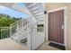 Condo entrance with stairs leading up to the door in this charming location at 107 Rum Run # 107, Davenport, FL 33897