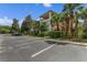 Condo exterior with a well-kept lawn and parking area, enhancing curb appeal at 107 Rum Run # 107, Davenport, FL 33897