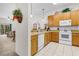 Well-lit kitchen equipped with modern appliances and a view into the living area at 107 Rum Run # 107, Davenport, FL 33897