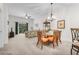 Spacious living and dining area with a view from the balcony and comfortable seating at 107 Rum Run # 107, Davenport, FL 33897