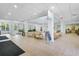 Bright lobby with lots of seating, tiled floor, signage, and well-manicured landscaping outdoors at 107 Rum Run # 107, Davenport, FL 33897