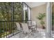 Covered patio with outdoor dining, overlooking lush greenery at 107 Rum Run # 107, Davenport, FL 33897