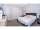 Neutral bedroom featuring a comfortable bed, large closet, and soft carpet at 1092 Sugarwood St, Davenport, FL 33837