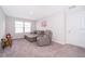 Living room featuring comfortable seating, plush carpet, and natural light at 1092 Sugarwood St, Davenport, FL 33837