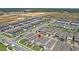 Bird's eye view showcasing the community's layout with modern homes, landscaping, and well-maintained streets at 12067 Eastmoor Dr, Winter Garden, FL 34787