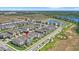Aerial shot featuring the community's beautiful pond, landscaping, and attractive residential properties at 12067 Eastmoor Dr, Winter Garden, FL 34787