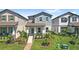 Charming two-story home with a well-manicured lawn and inviting front porch at 12067 Eastmoor Dr, Winter Garden, FL 34787