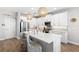 Bright kitchen featuring a large island with seating and stainless steel appliances at 12067 Eastmoor Dr, Winter Garden, FL 34787