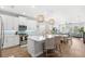 Modern kitchen with a large island and counter seating open to the living area at 12067 Eastmoor Dr, Winter Garden, FL 34787