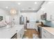 Bright kitchen with white cabinetry, stainless appliances, and a large island with a sink at 12067 Eastmoor Dr, Winter Garden, FL 34787