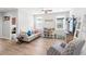 Inviting living room with a plush sofa, armchair, and cute decorative display shelves at 12067 Eastmoor Dr, Winter Garden, FL 34787