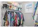 Organized walk-in closet with shelving, hanging racks, and ample storage space for clothing and accessories at 12067 Eastmoor Dr, Winter Garden, FL 34787