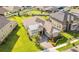 Aerial view of a beautiful single-story home with lush green lawn and professional landscaping at 12334 Upper Harden Ave, Orlando, FL 32827