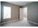 Comfortable bedroom boasts neutral colors, plush carpet, and a walk-in closet at 12334 Upper Harden Ave, Orlando, FL 32827