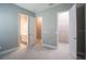 Bedroom showcasing two doorways, one leading to the closet, the other to the bathroom at 12334 Upper Harden Ave, Orlando, FL 32827