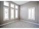 Bedroom with large windows featuring plantation shutters, letting in natural light at 12334 Upper Harden Ave, Orlando, FL 32827