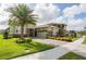 Attractive two-story home with lush landscaping, a beautiful lawn and brick driveway at 12334 Upper Harden Ave, Orlando, FL 32827