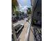 Street view from a balcony with seating, potted plants and decorative pillows at 12955 Cats Claw Ln, Orlando, FL 32828