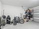 Spacious garage equipped with weightlifting equipment and bicycle storage, perfect for fitness enthusiasts at 12955 Cats Claw Ln, Orlando, FL 32828
