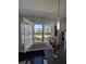 Bright kitchen window with shuttered doors, offering a pleasant view of the community at 12955 Cats Claw Ln, Orlando, FL 32828