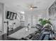 Comfortable living area with modern furniture, French doors, and elegant decor at 12955 Cats Claw Ln, Orlando, FL 32828