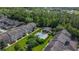 A beautiful aerial view showcasing the community pool and gazebo surrounded by manicured landscaping at 12955 Cats Claw Ln, Orlando, FL 32828