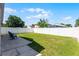 Fenced backyard features a well maintained lawn at 13416 Greenpointe Dr, Orlando, FL 32824