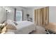 Bedroom features tile flooring, white bed frame, and curtains at 13416 Greenpointe Dr, Orlando, FL 32824