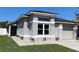 Charming single-story home featuring a neutral stucco finish, white trim, and an attached two-car garage at 13416 Greenpointe Dr, Orlando, FL 32824