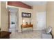 Welcoming foyer featuring neutral tile floors, high ceilings, and a charming entry table with decor at 13416 Greenpointe Dr, Orlando, FL 32824