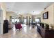 Bright living room featuring neutral tile floors, comfortable seating, and sliding glass doors to the lanai at 13416 Greenpointe Dr, Orlando, FL 32824