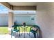 Covered patio area with table and chairs at 13416 Greenpointe Dr, Orlando, FL 32824