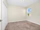 Bedroom with a large closet, neutral carpet, and a window for natural light at 1415 Oak Marsh St, Davenport, FL 33837