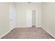 Carpeted bedroom featuring a closet and a window that provides natural light at 1415 Oak Marsh St, Davenport, FL 33837