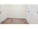 Walk-in closet with carpet flooring, shelving, and ample storage space at 1415 Oak Marsh St, Davenport, FL 33837