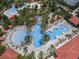 Overhead shot of a resort style pool and amenities including a lazy river and splashpad area at 1415 Oak Marsh St, Davenport, FL 33837