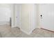 Hallway with tile flooring, a bathroom doorway, a closet, and a front entry door at 1415 Oak Marsh St, Davenport, FL 33837