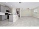 The kitchen area has gray cabinetry and stainless steel appliances at 1415 Oak Marsh St, Davenport, FL 33837