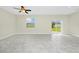 Bright living area offers tile floors and sliding glass doors to backyard at 1415 Oak Marsh St, Davenport, FL 33837