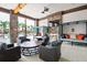 Comfortable outdoor lounge featuring plush seating, a fireplace, and a TV for relaxing at 1415 Oak Marsh St, Davenport, FL 33837